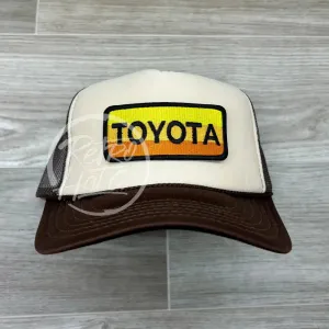 Retro Toyota Patch on Brown/Beige Trucker Hat